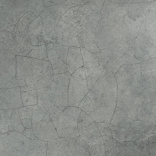 Close-up of a textured gray concrete surface with a network of fine cracks creating an intricate pattern.