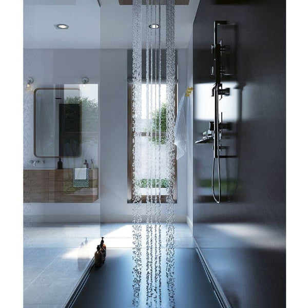 Modern bathroom interior with reflective floor, spacious walk-in shower featuring a large overhead waterfall shower head, and sleek metal fixtures with a view of greenery outside the window.