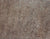 Close-up texture of a brown grunge surface with speckled patterns and rough finish suitable for background or wallpaper use.