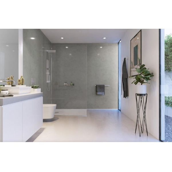 Modern bathroom interior with walk-in shower, wall-mounted toilet, double vanity sink, large mirror, recessed lighting, decorative plants, and framed artwork.