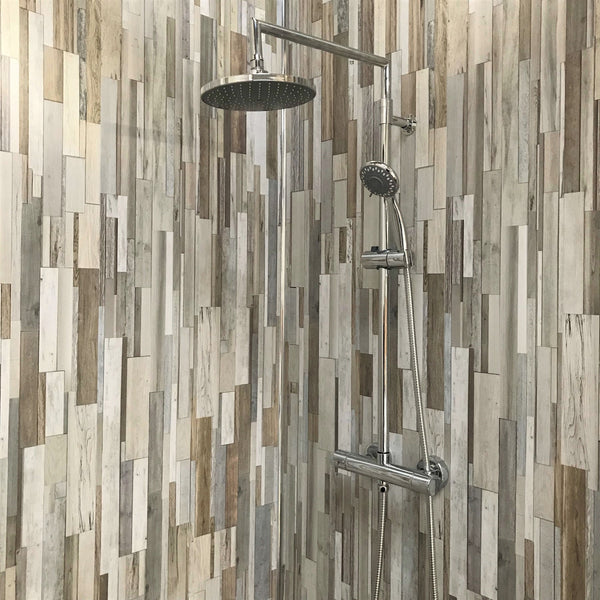 Modern shower with rain showerhead, handheld shower and unique vertical mosaic tile design in neutral tones