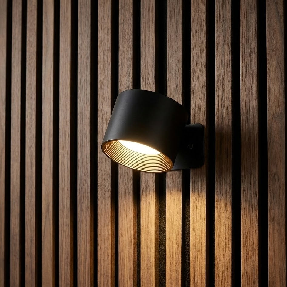 Black wall-mounted light fixture on a wooden slat background