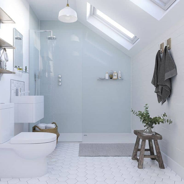 Modern bathroom interior with walk-in shower, floating vanity, wall-mounted toilet, skylight, pendant light, and minimalist decor.