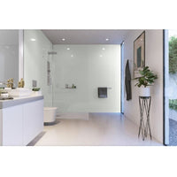 Modern bathroom interior design with white minimalist vanity, wall-mounted sink, large mirror, walk-in shower with clear glass enclosure, wall-hung toilet, recessed shelves, decorative plants, and framed wall art.