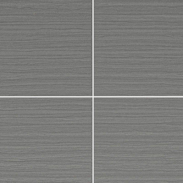 Textured gray ceramic tiles with white grout lines in a grid layout, modern matte finish tile flooring or wall design