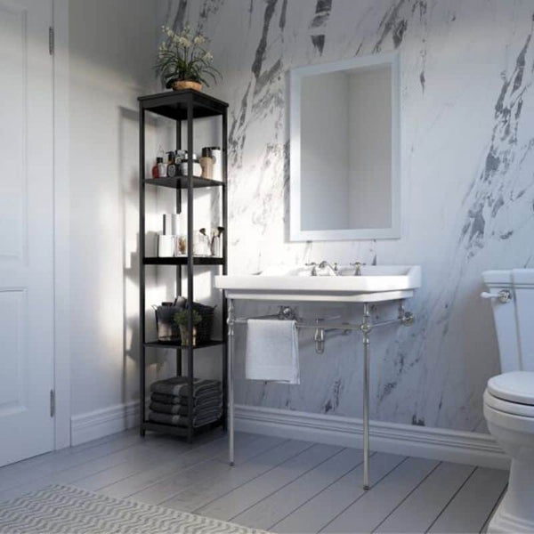 Modern bathroom interior with marble walls, white porcelain sink, mirrored cabinet, grey towels on shelf storage, and toilet.