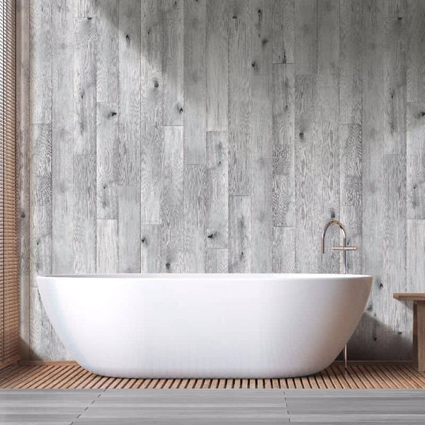 Modern bathroom with freestanding white bathtub against rustic wood plank wall, wooden floor mat, minimalist interior design, luxury spa decor, elegant bath fittings and fixtures