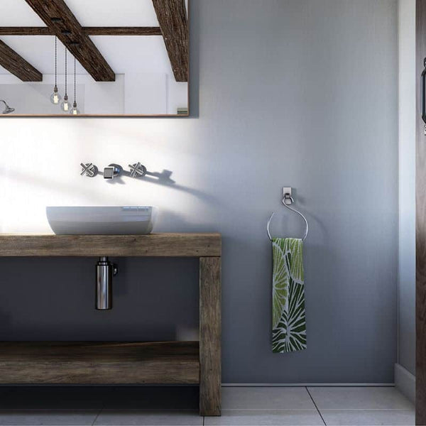 Modern bathroom interior with rustic wooden vanity, vessel sink, wall-mounted faucet, pendant lights, large mirror, and decorative towel on holder.