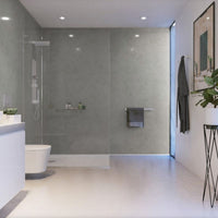 Modern bathroom interior with glass shower enclosure, white freestanding bathtub, wall-mounted sink, towel rack, framed artwork, and indoor plant.