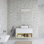 Modern bathroom interior with floating vanity, vessel sink, large mirror, tiled walls, and white fixtures.